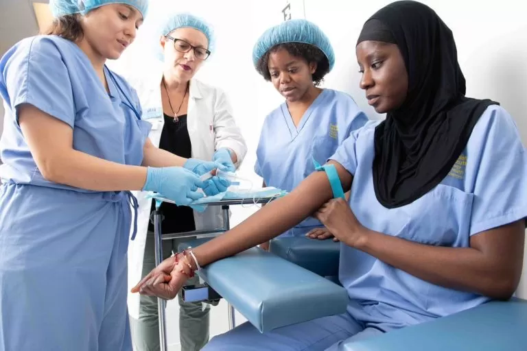 medical assistant students in training. Learn the benefits of being a medical assistant.