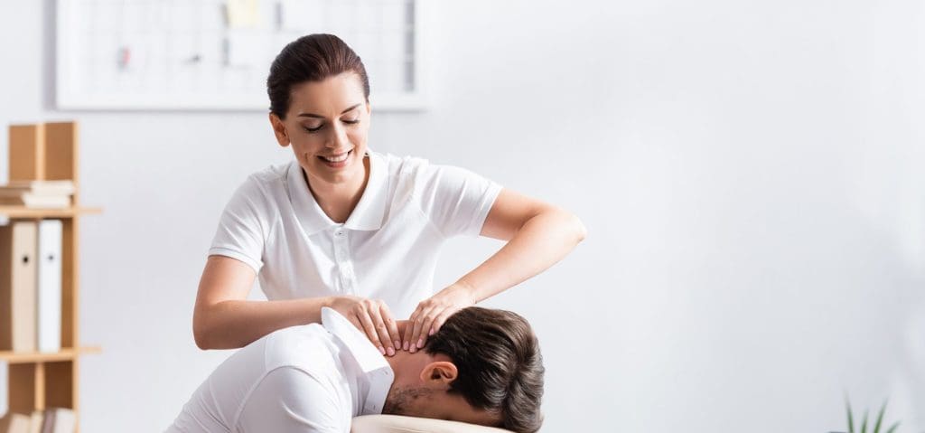 massage therapist performing a deep tissue massage